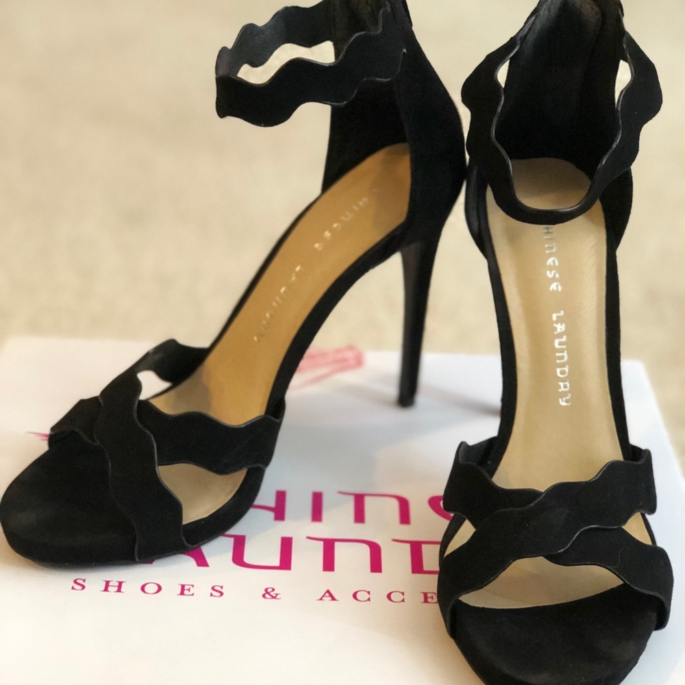 Black scalloped shaped heels